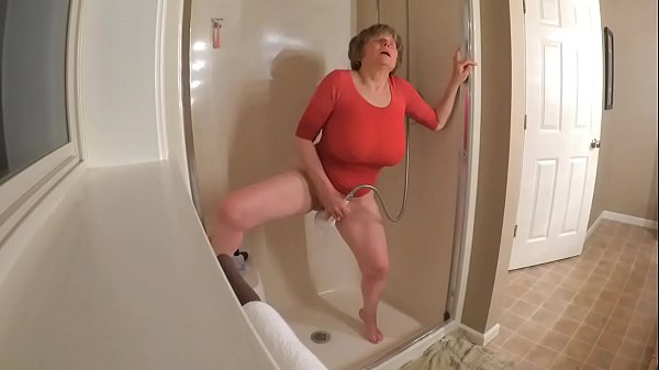 60 GILF masturbating in wet t-shirt